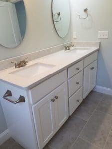 Interior bathroom with white cabinets and sink